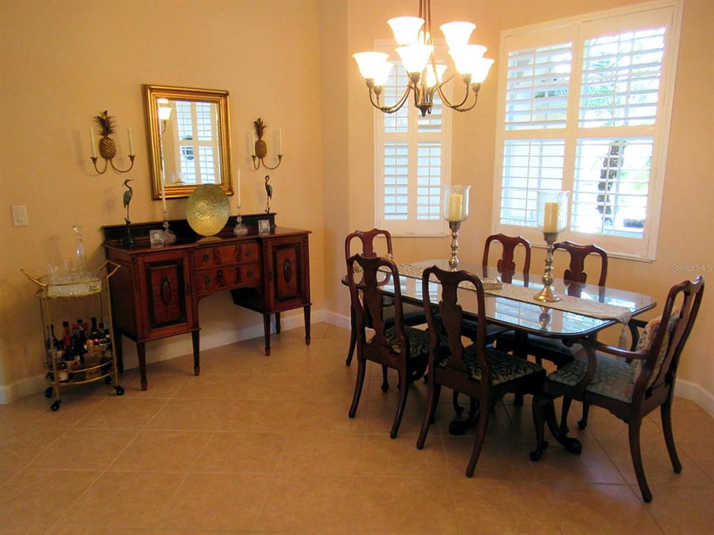 114 Rimini Way North Venice, FL 34275 - Photo 4 of 54 a view of a dining room with furniture and window