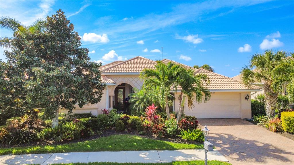 114 Rimini Way North Venice, FL 34275 - Photo 49 of 54 a front view of a house with a yard