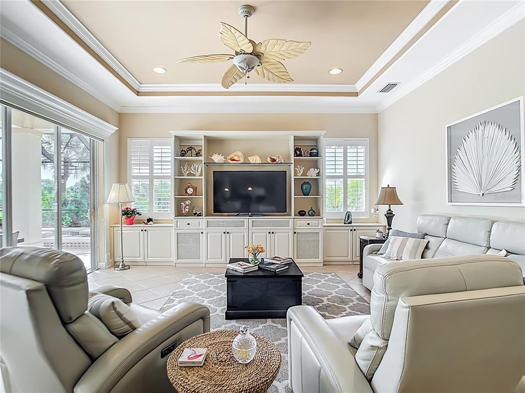 114 Rimini Way North Venice, FL 34275 - Photo 6 of 54 a living room with furniture and a flat screen tv