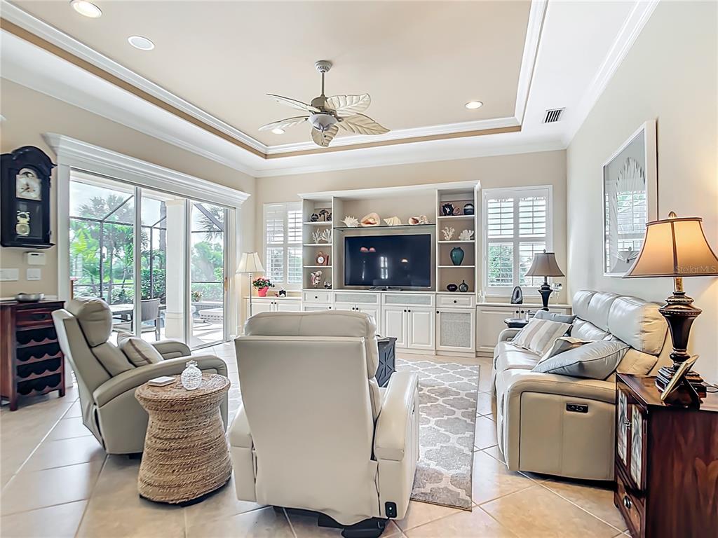 114 Rimini Way North Venice, FL 34275 - Photo 7 of 54 a living room with furniture and flat screen tv