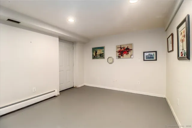 an empty room with a refrigerator