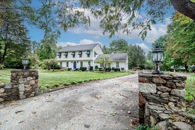 a view of house with yard