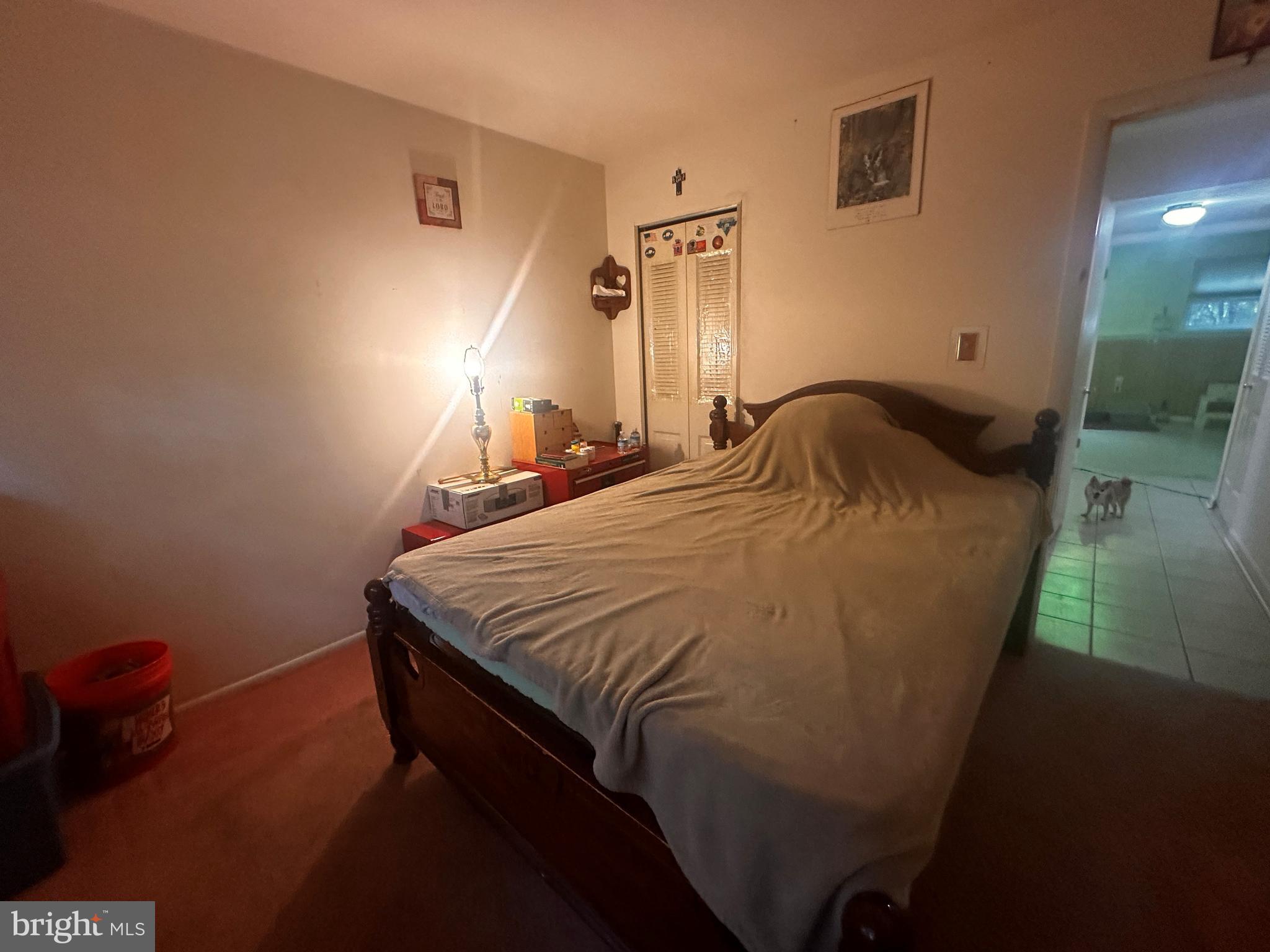 119 Redbud Road Edgewood, MD 21040 - Photo 15 of 31 a bed sitting in a bedroom next to a lamp