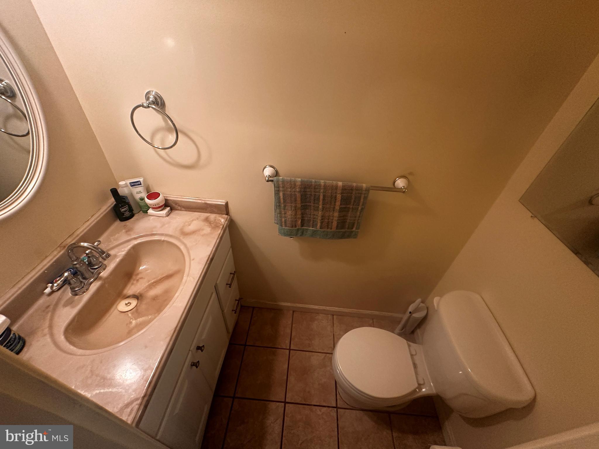119 Redbud Road Edgewood, MD 21040 - Photo 17 of 31 a bathroom with a granite countertop sink mirror vanity and toilet