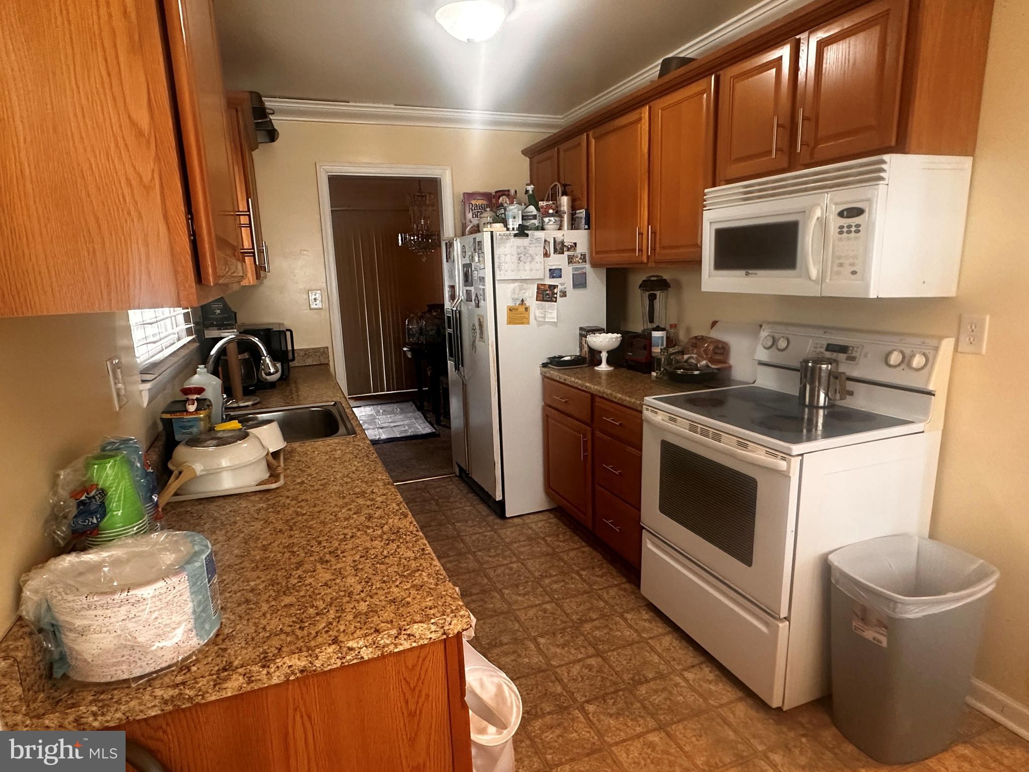 119 Redbud Road Edgewood, MD 21040 - Photo 4 of 31 a kitchen with sink refrigerator and stove