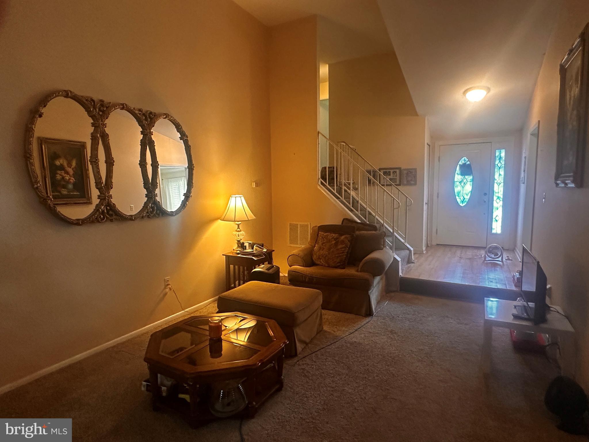119 Redbud Road Edgewood, MD 21040 - Photo 5 of 31 a living room with table and chairs