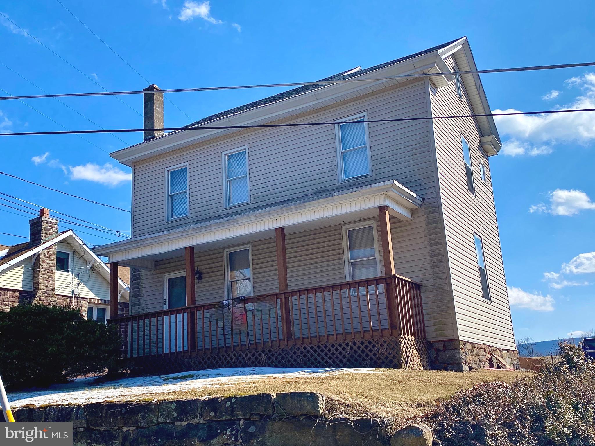 128 Barry Road Ashland, PA 17921 - Photo 1 of 19 a front view of a house with a yard