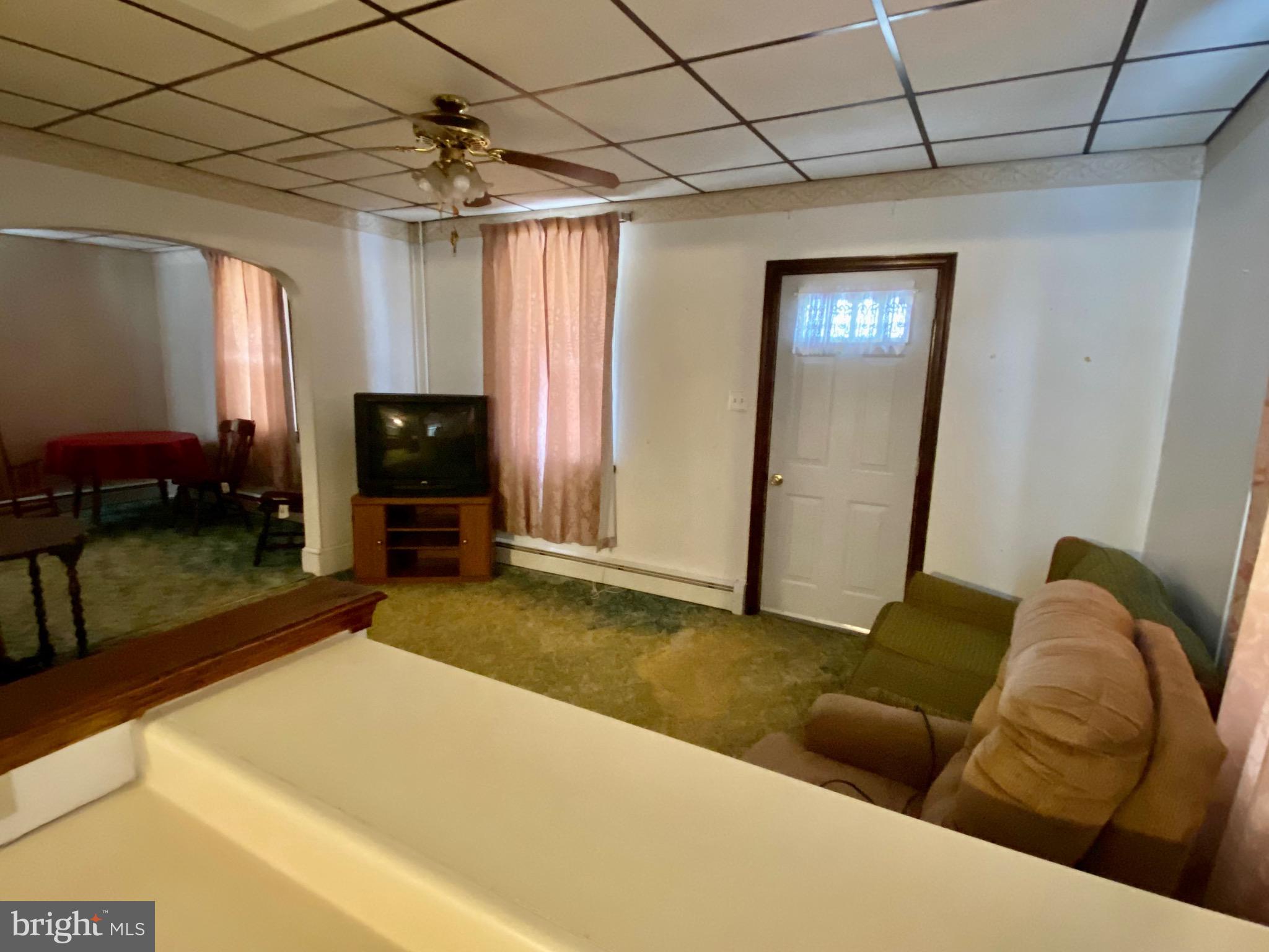 128 Barry Road Ashland, PA 17921 - Photo 8 of 19 a living room with furniture and a flat screen tv