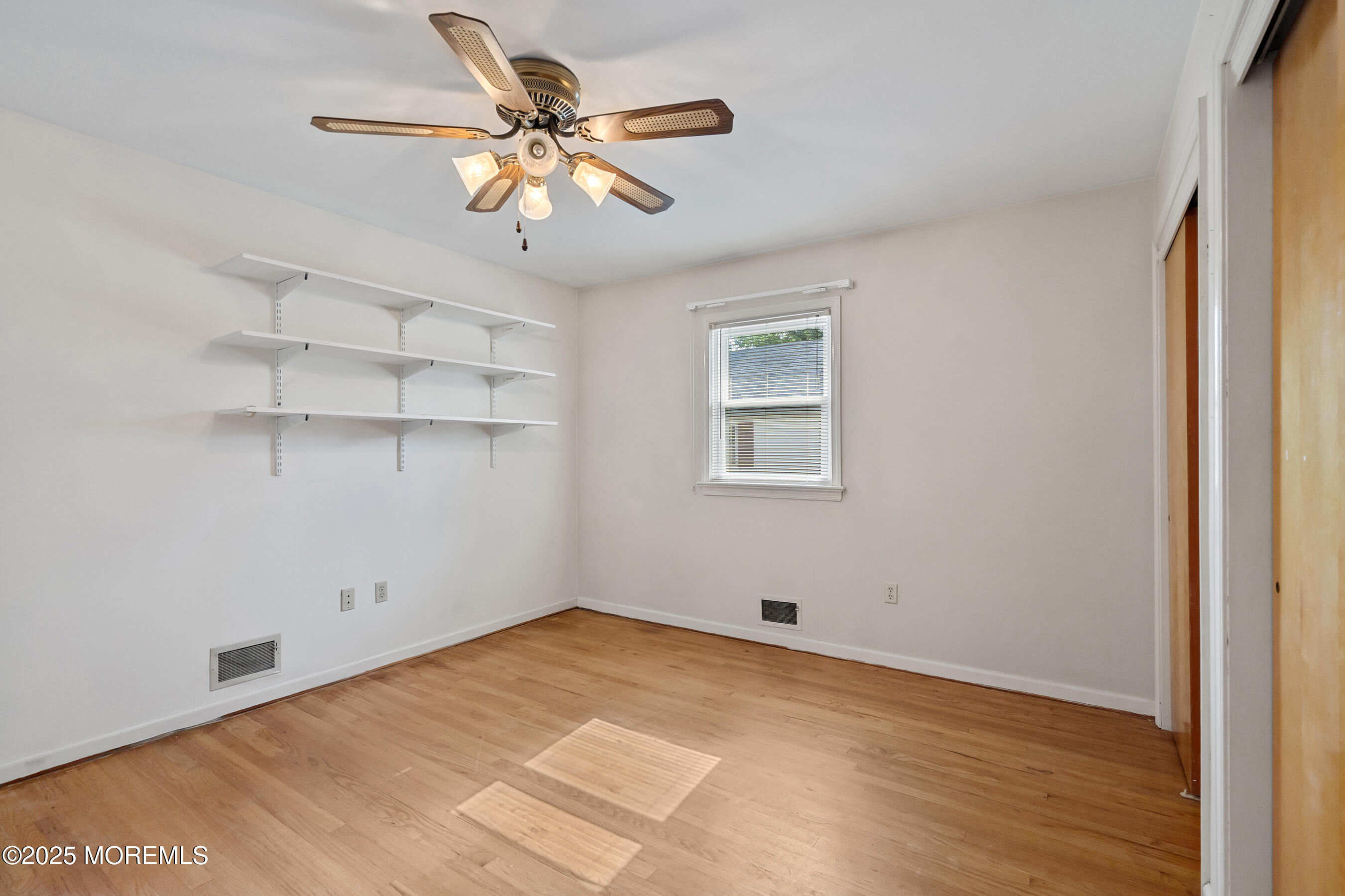 6 Kim Valley Road Hamilton, NJ 08620 - Photo 12 of 27 a view of a room with wooden floor and white walls