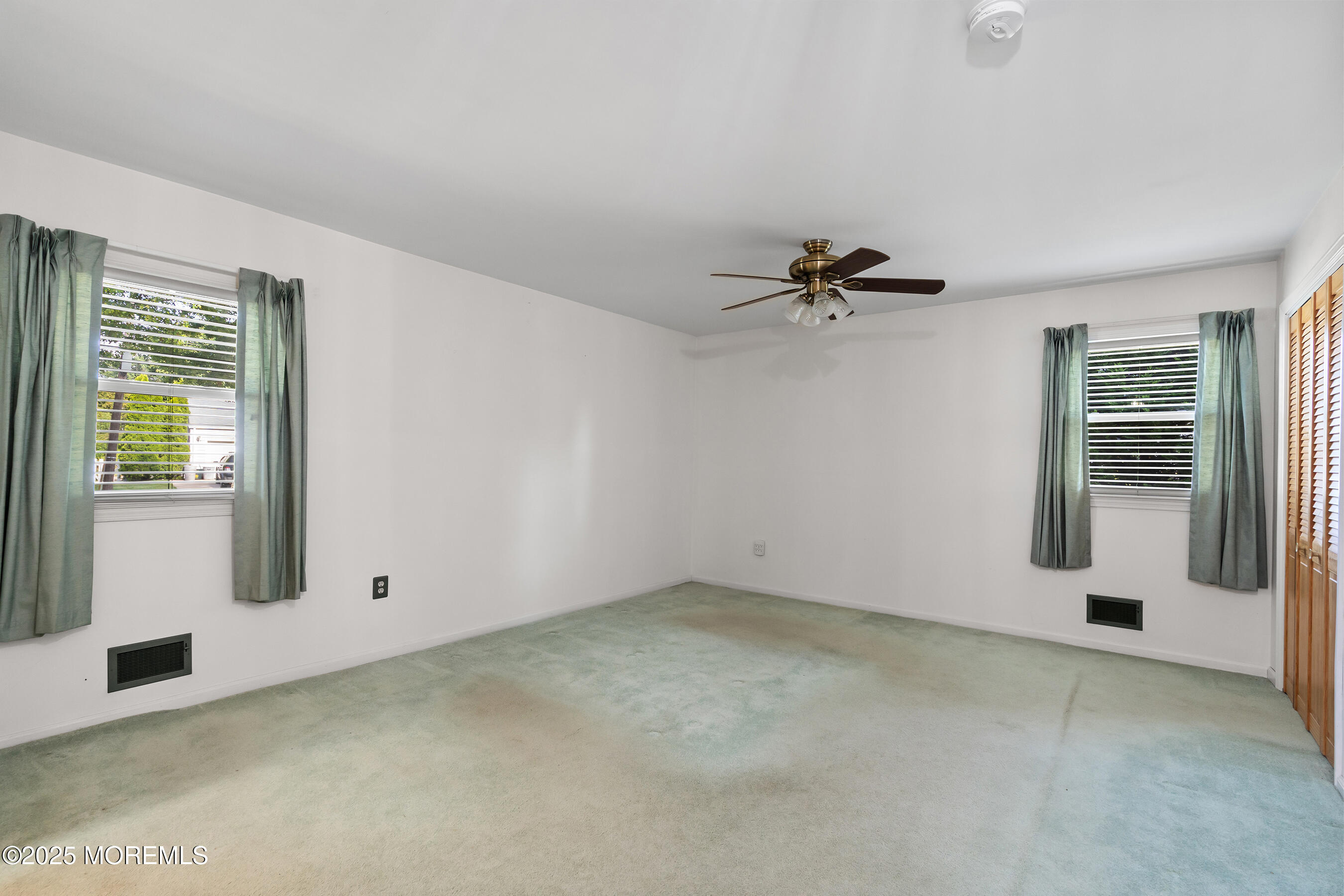 6 Kim Valley Road Hamilton, NJ 08620 - Photo 15 of 27 a view of a livingroom with a ceiling fan and window