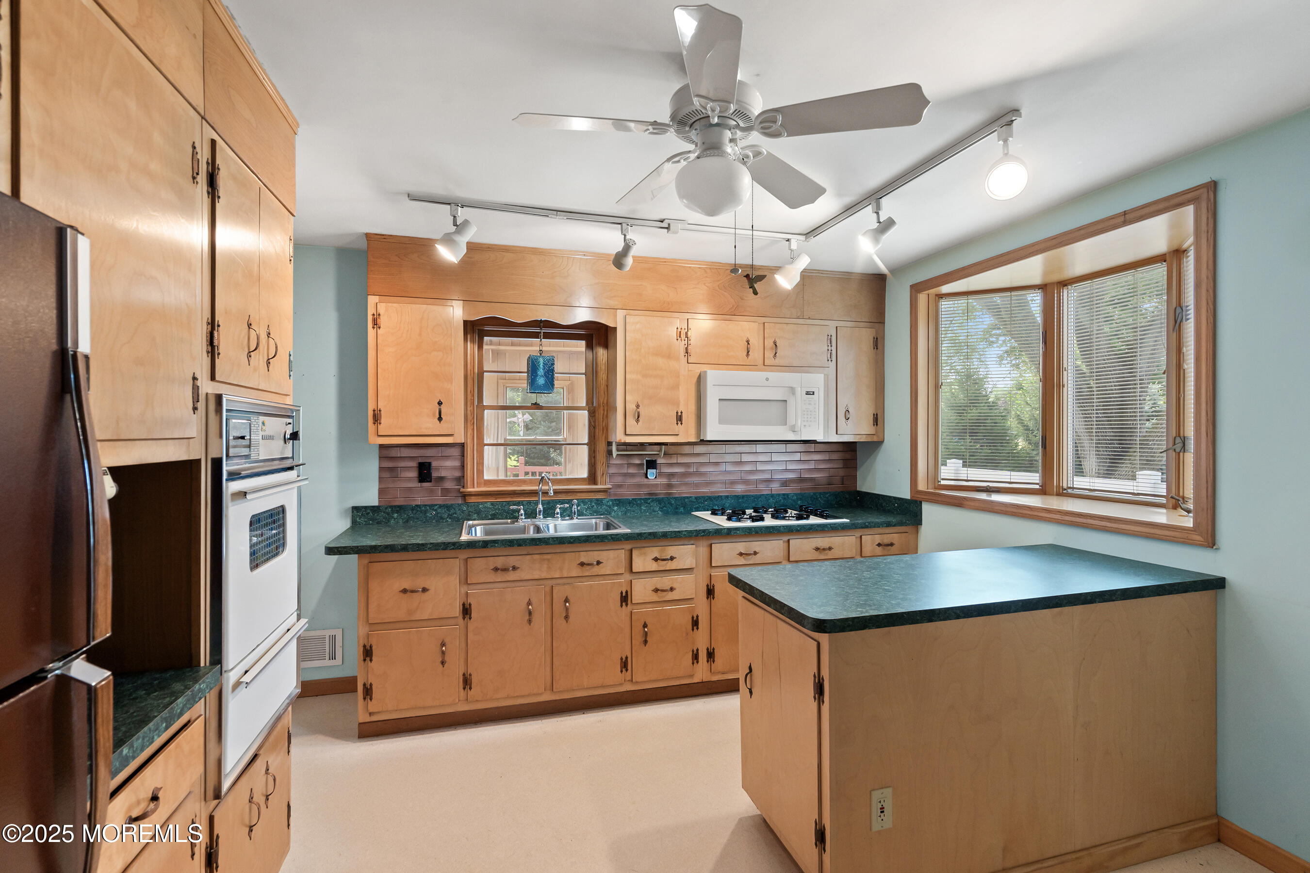 6 Kim Valley Road Hamilton, NJ 08620 - Photo 4 of 27 a kitchen with stainless steel appliances granite countertop a stove a sink and a refrigerator