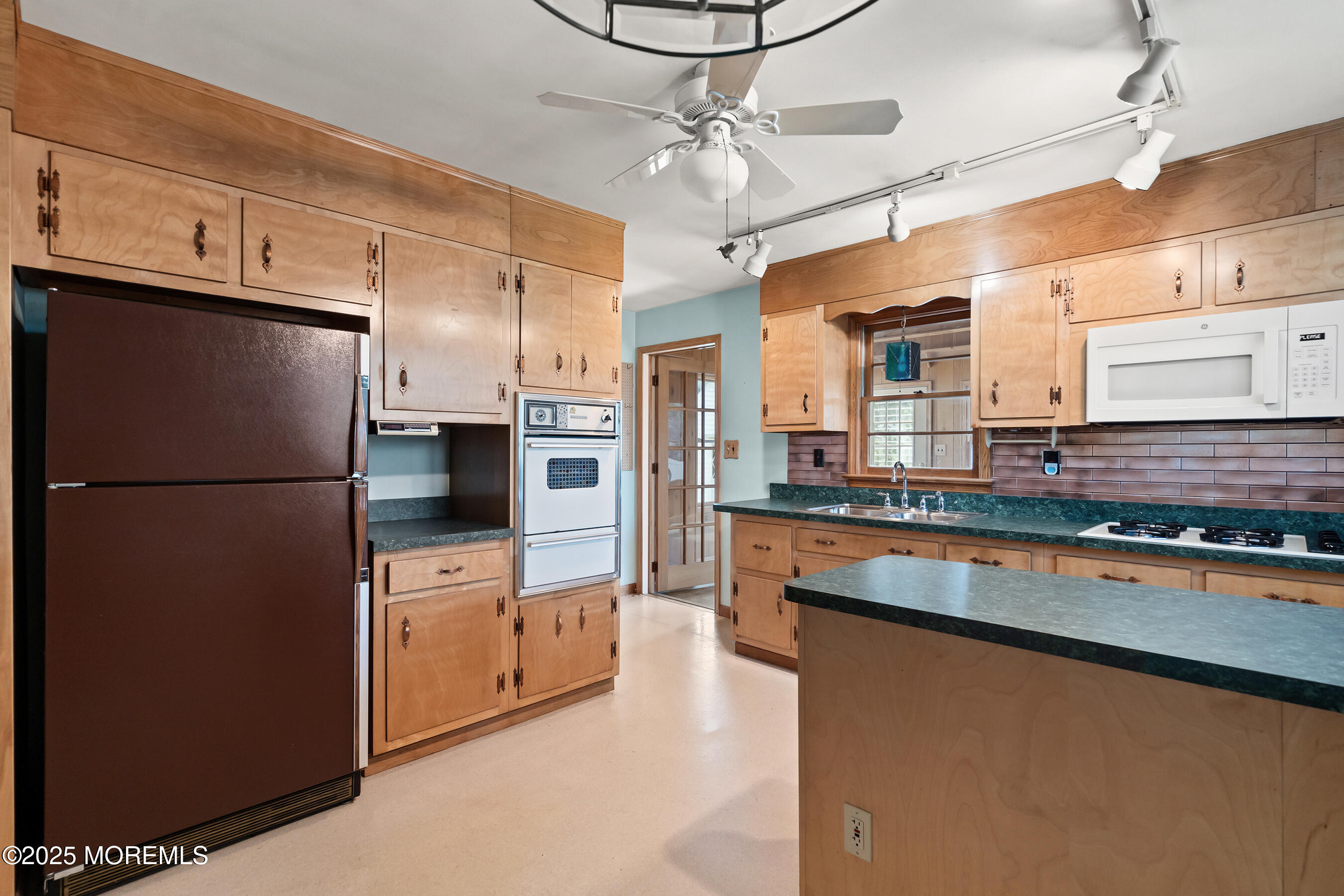 6 Kim Valley Road Hamilton, NJ 08620 - Photo 5 of 27 a kitchen with stainless steel appliances granite countertop a refrigerator a stove and a sink