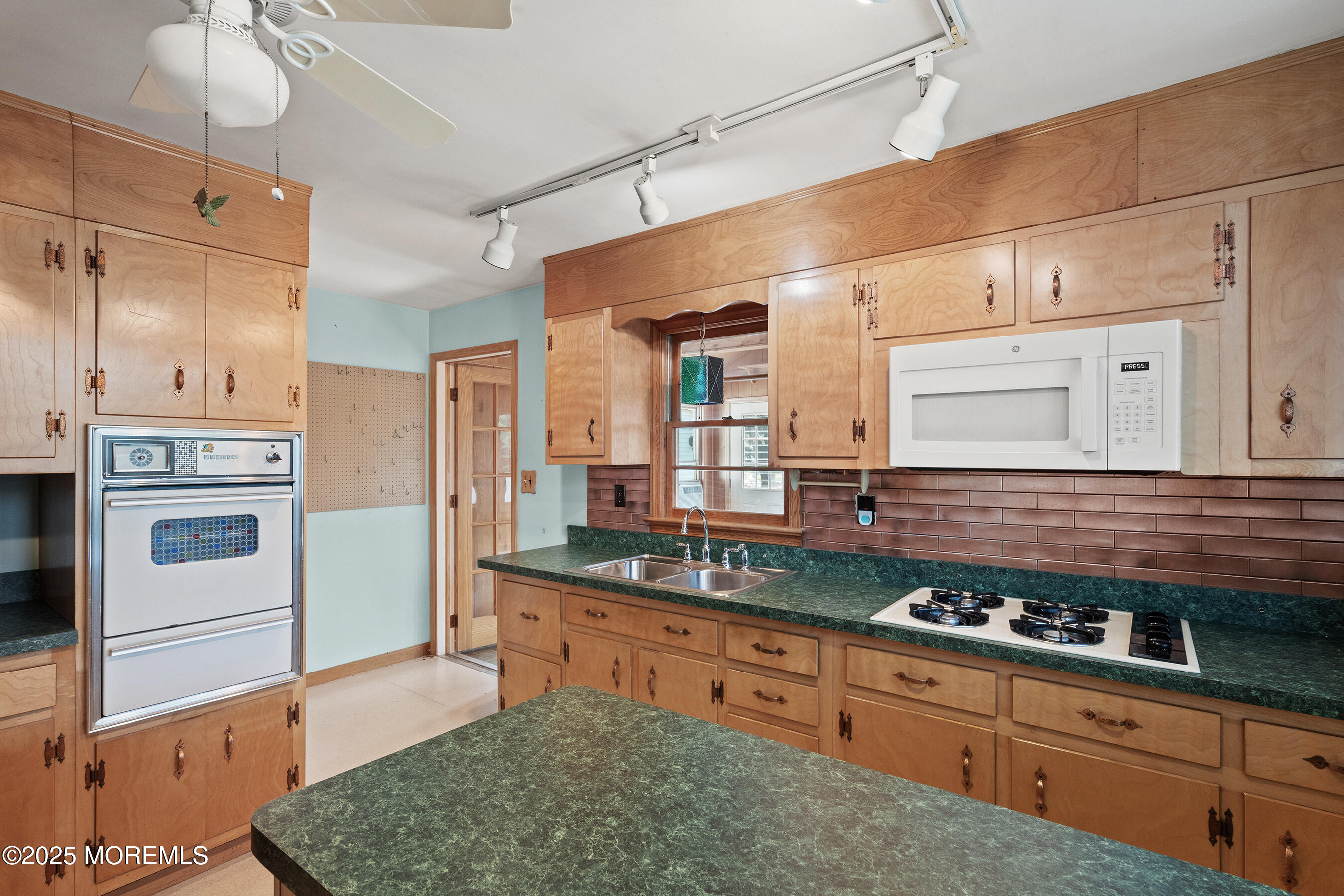 6 Kim Valley Road Hamilton, NJ 08620 - Photo 7 of 27 a kitchen with stainless steel appliances granite countertop a sink and cabinets