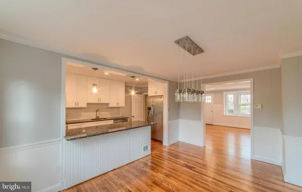 a view of a kitchen from the hallway