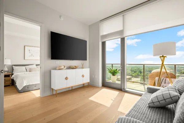 a living room with furniture and a flat screen tv