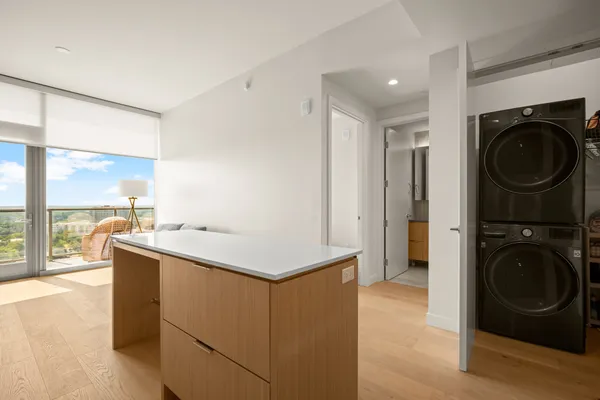 a kitchen with a stove top oven and sink