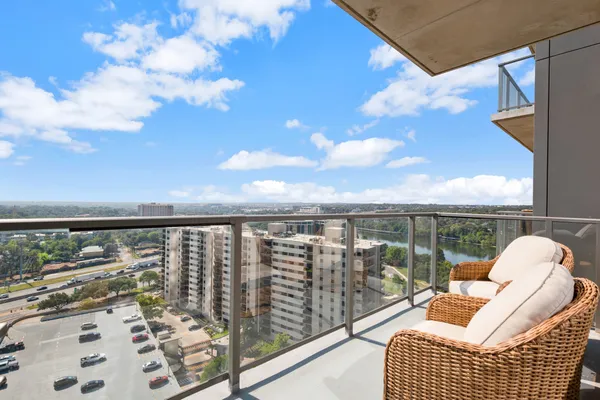 a balcony with chairs