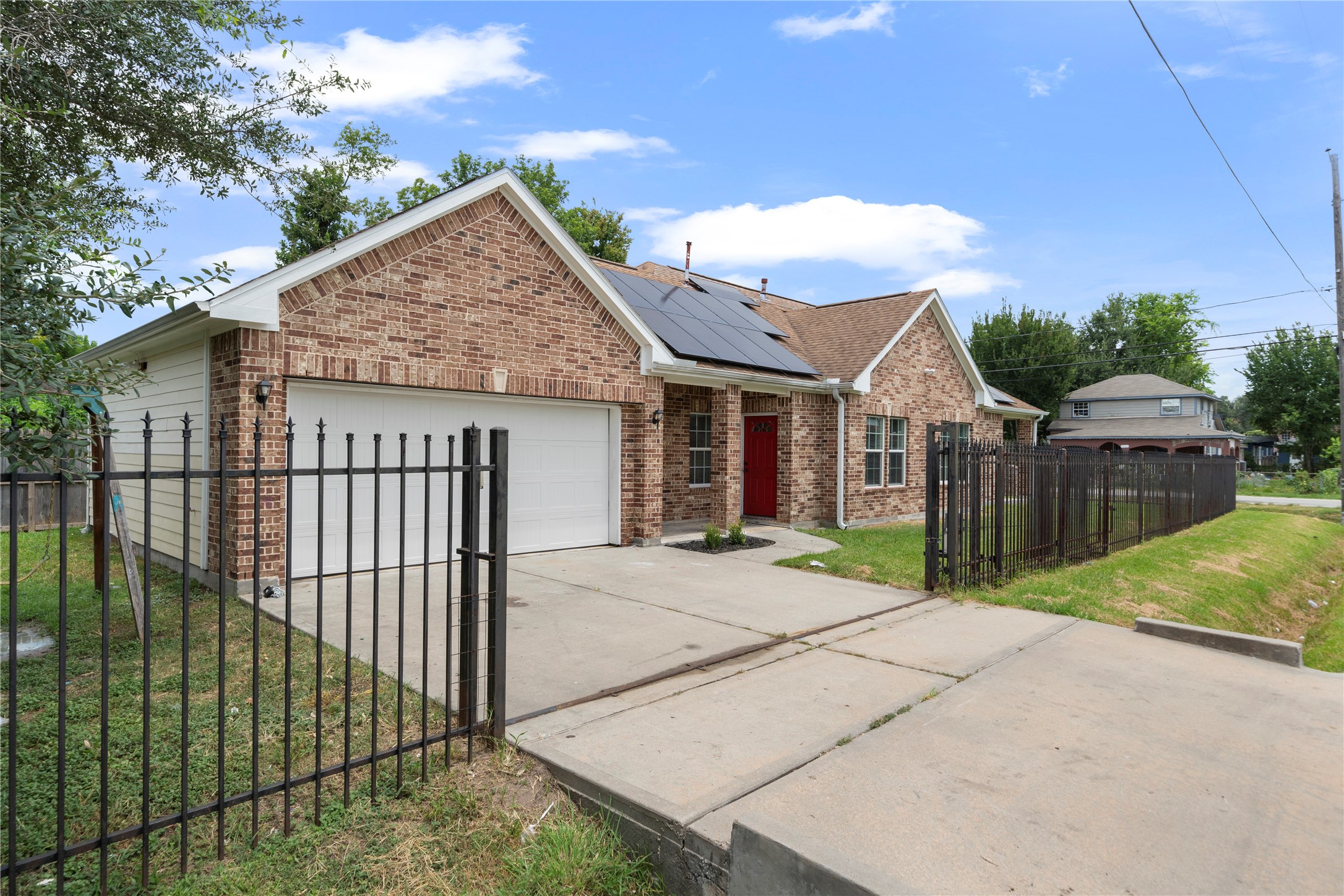 3001 Wayne Street Houston, TX 77026 - Photo 3 of 31 A functioning automatic gate allows entry into the garage with added security