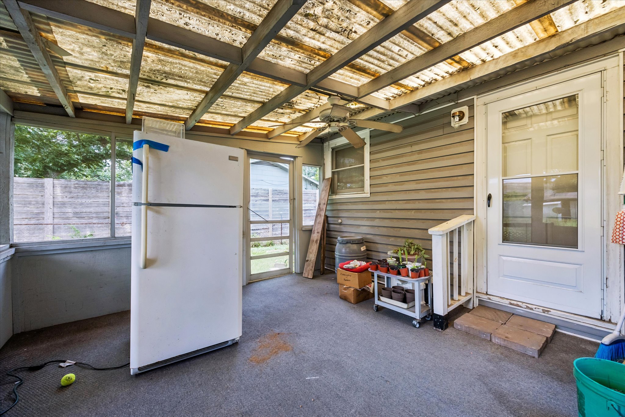 2009 Fort View Road Austin, TX 78704 - Photo 31 of 40 A utilitarian screened porch offers practical storage and a sheltered space for various household tasks.