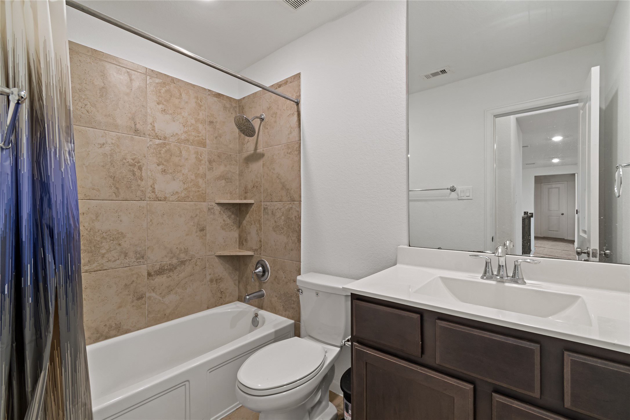 14010 Hartford Heights Way Rosharon, TX 77583 - Photo 16 of 30 a bathroom with a sink a toilet and shower