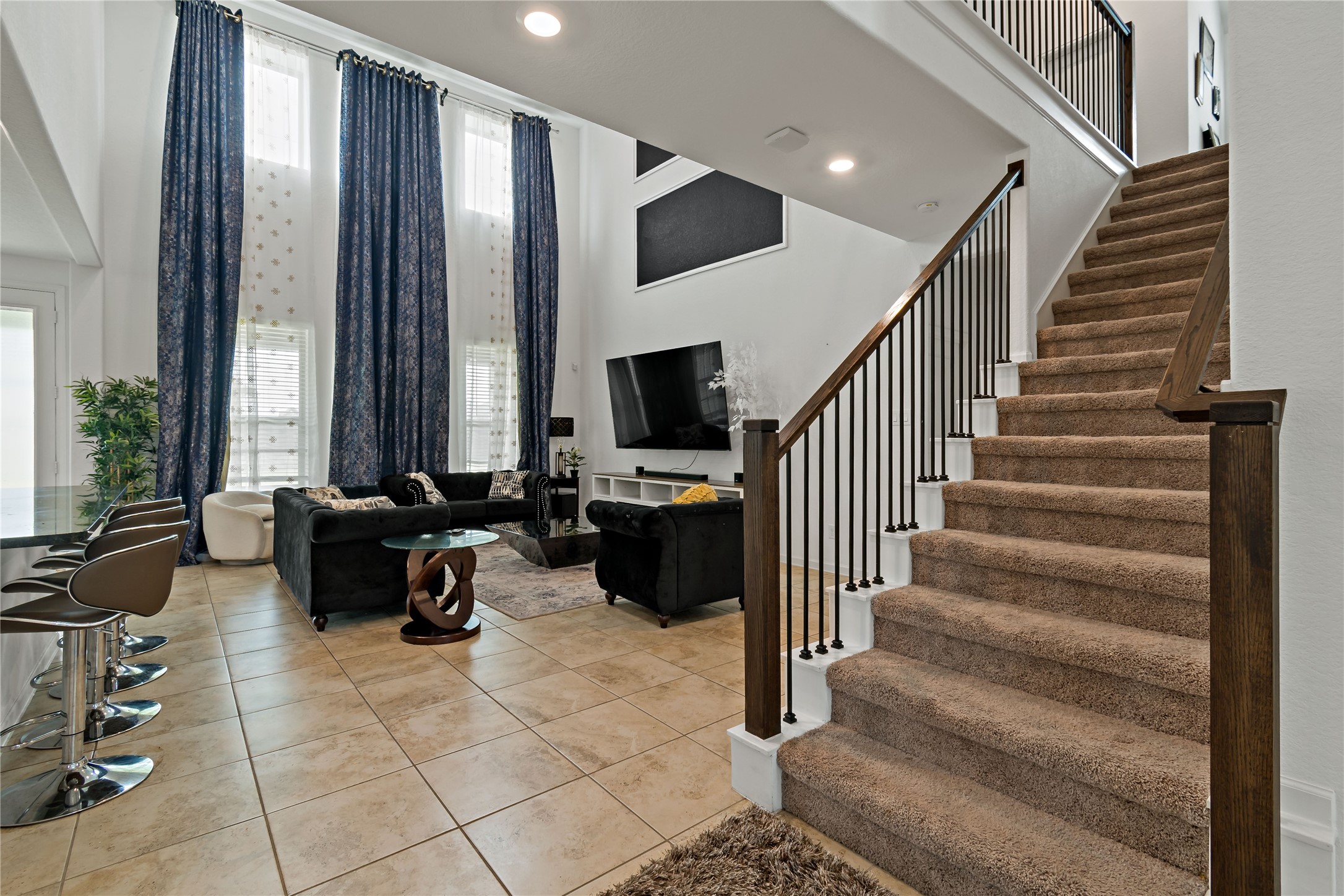 14010 Hartford Heights Way Rosharon, TX 77583 - Photo 24 of 30 a living room with furniture and stairs