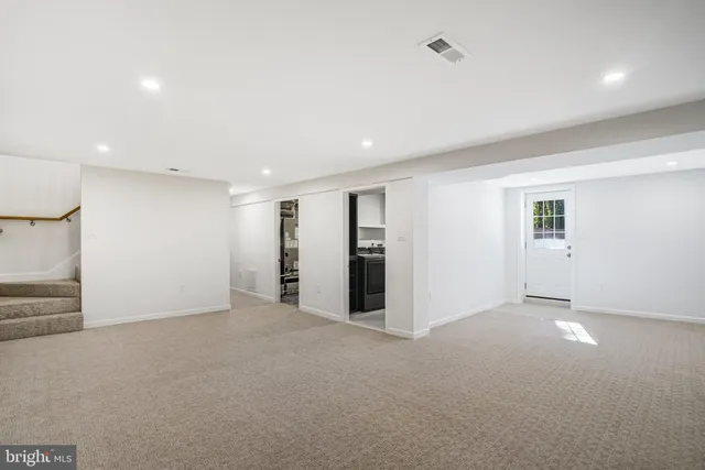 an empty room with closet area