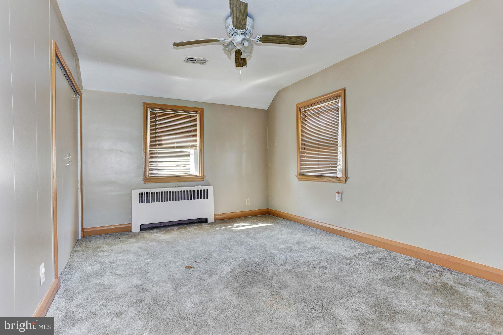 3127 Dunglow Road Baltimore, MD 21222 - Photo 11 of 14 a view of an empty room with a window