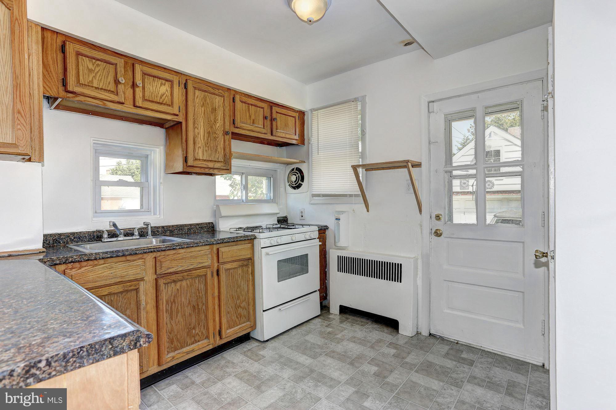 3127 Dunglow Road Baltimore, MD 21222 - Photo 8 of 14 a kitchen with a stove oven and a sink