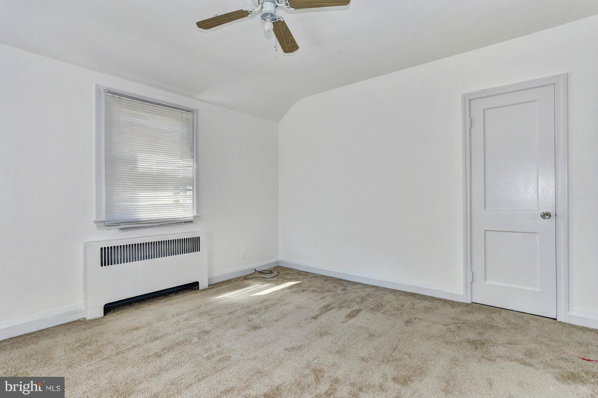 3127 Dunglow Road Baltimore, MD 21222 - Photo 9 of 14 a view of an empty room with a window