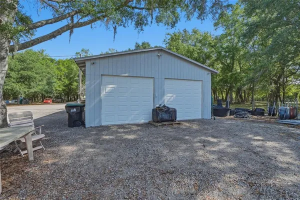 a view of a house with a yard and garage