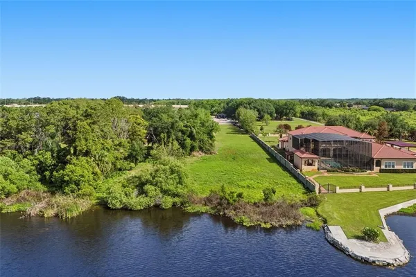 a view of a lake with a house in the background