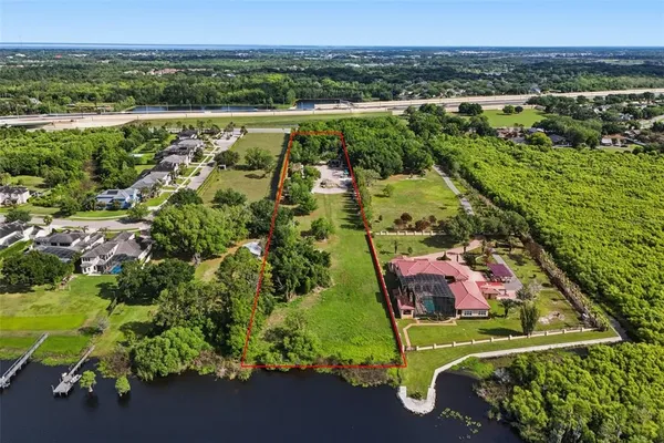 an aerial view of residential house with outdoor space