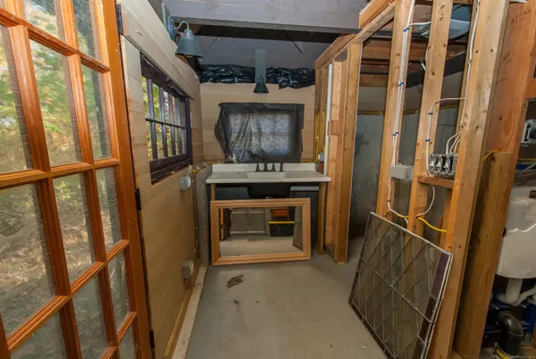 a bathroom with a toilet and shower