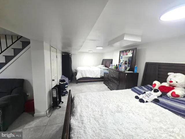 a bed room with furniture and a couch