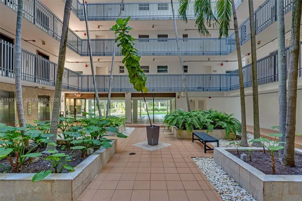 a view of a building with sitting area