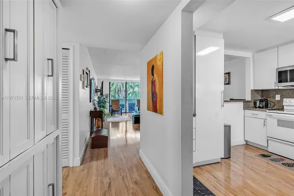 a view of a kitchen from the hallway