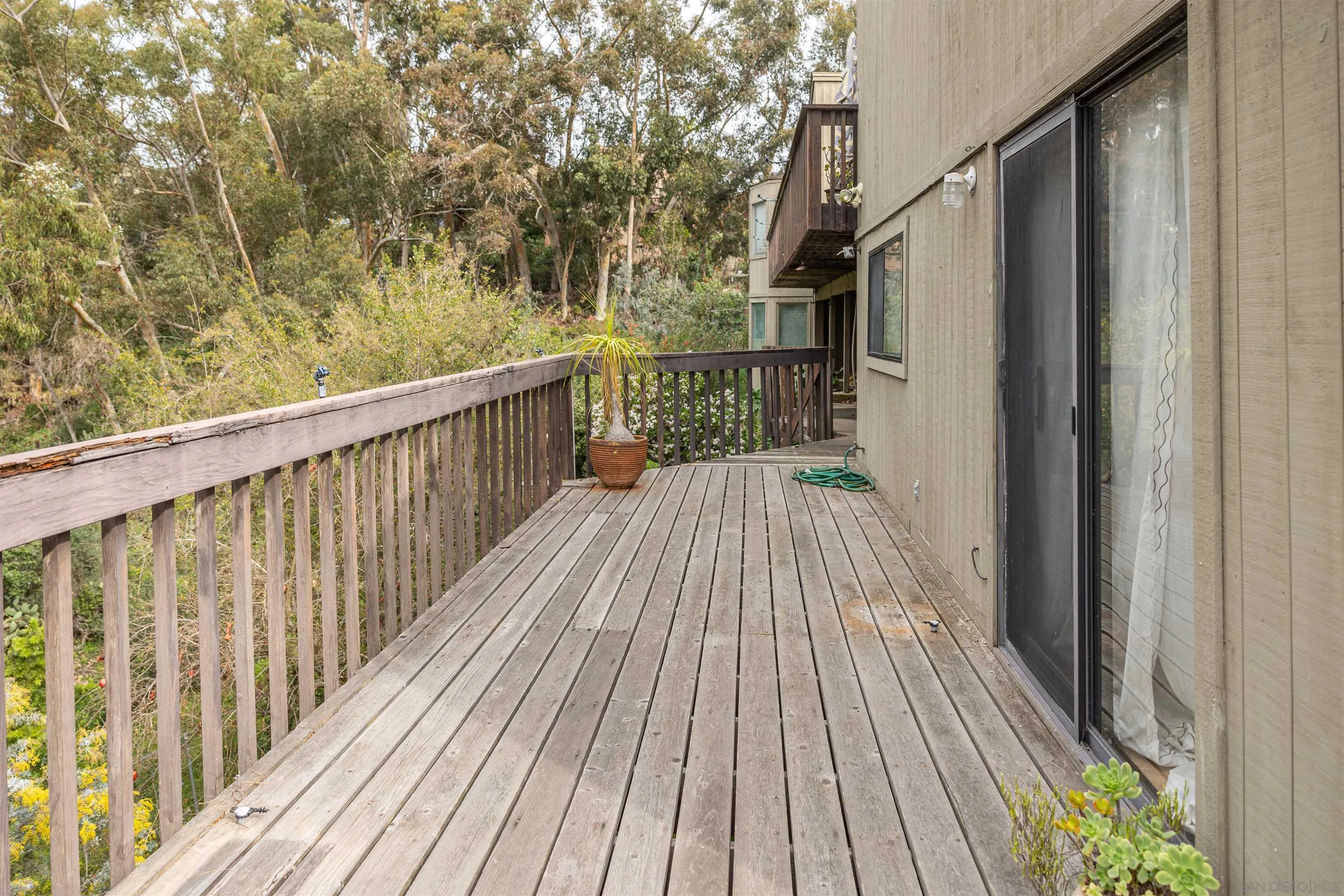 4291 Allen Road San Diego, CA 92103 - Photo 27 of 30 a balcony with wooden floor and fence