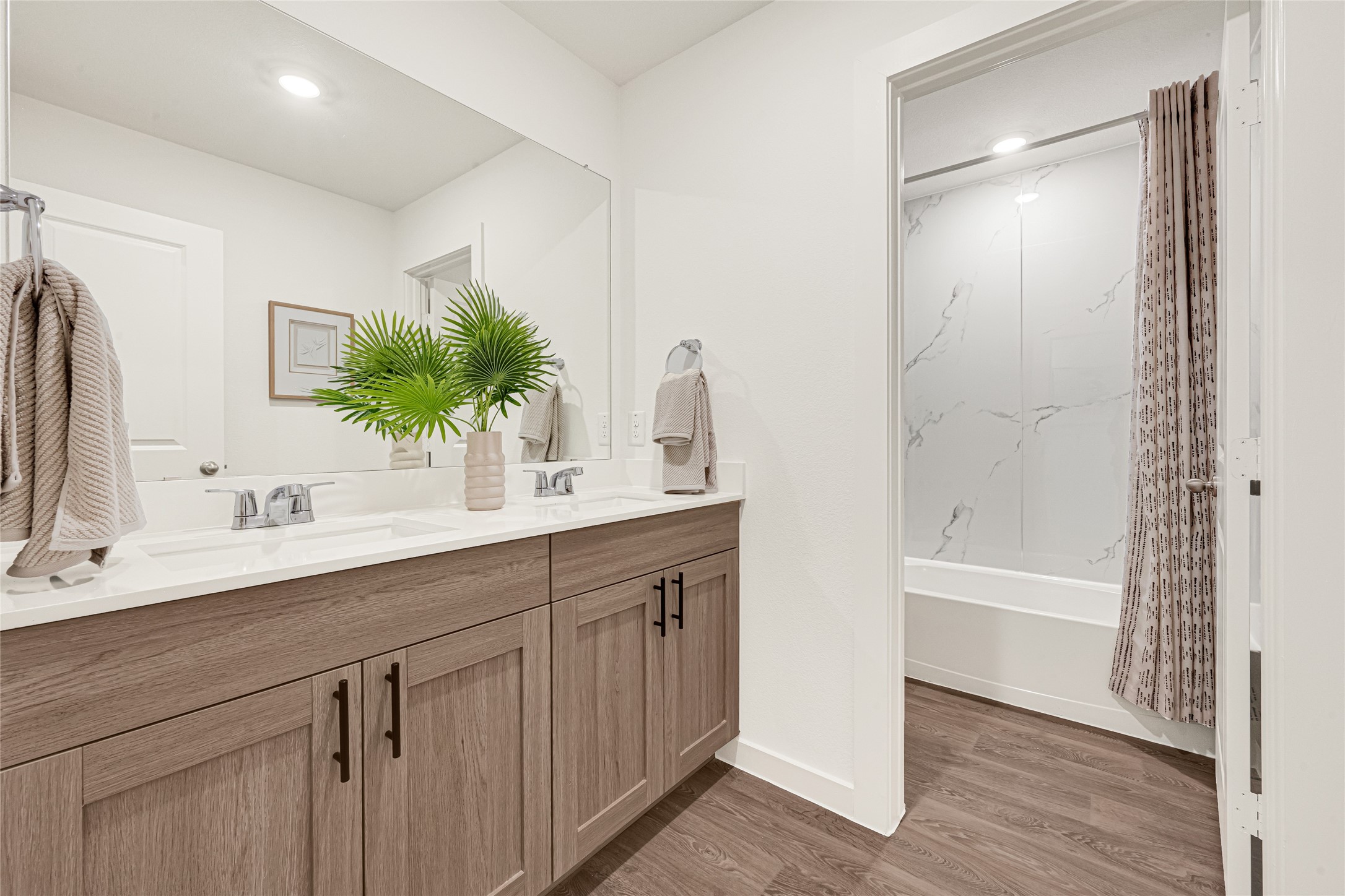 6204 Brookhaven Street Rosenberg, TX 77469 - Photo 25 of 33 a bathroom with a double vanity sink a large mirror and shower