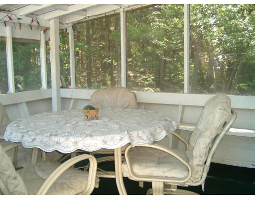 24 Russet Road Billerica, MA 01821 - Photo 6 of 13 a living room with a large window and table