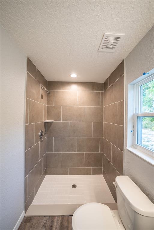 15673 Southwest 37th Circle Ocala, FL 34473 - Photo 11 of 19 a bathroom with a toilet a bath tub and a shower