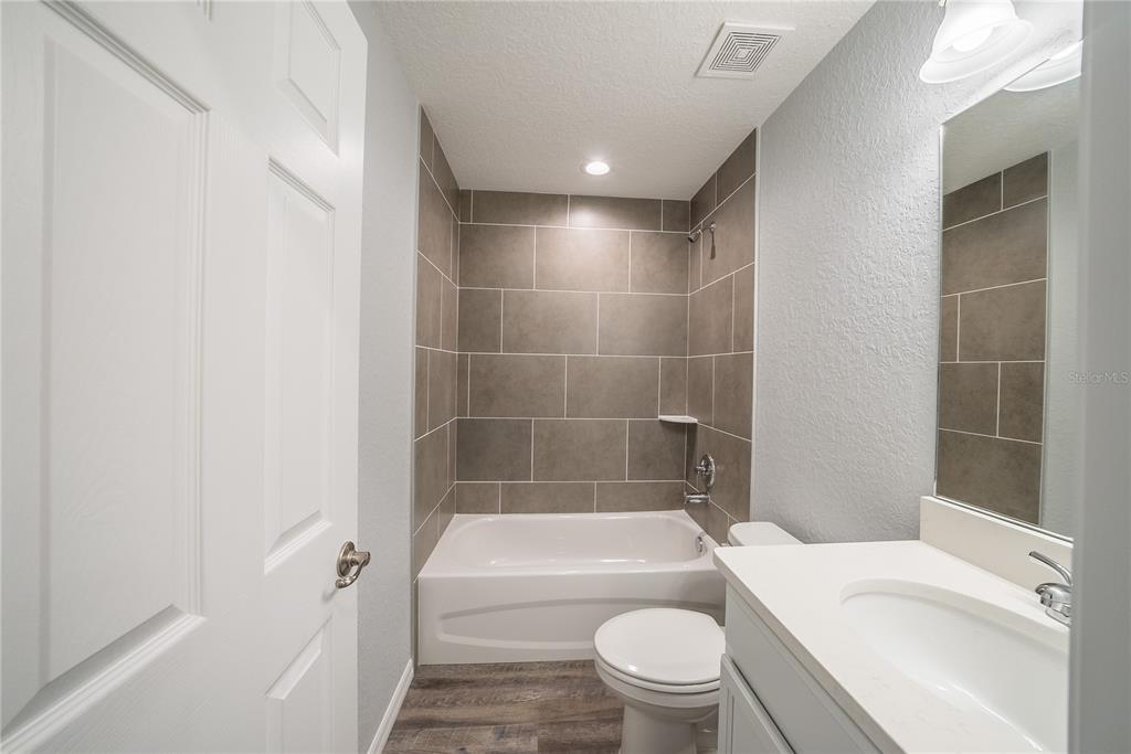 15673 Southwest 37th Circle Ocala, FL 34473 - Photo 14 of 19 a bathroom with a bathtub toilet and sink