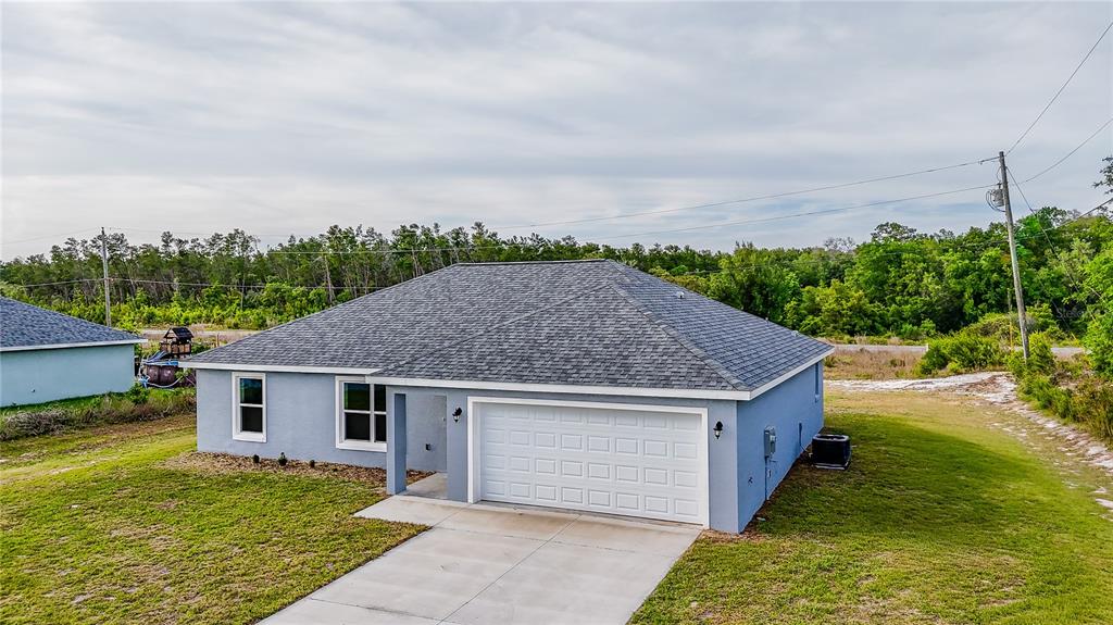 15673 Southwest 37th Circle Ocala, FL 34473 - Photo 19 of 19 a aerial view of a house next to a big yard