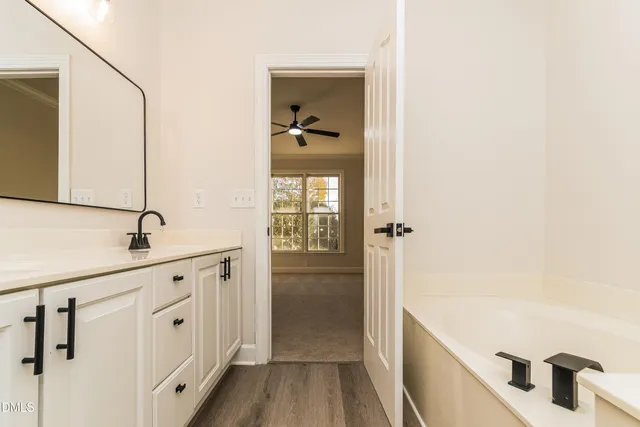a bathroom with a bathtub and a sink
