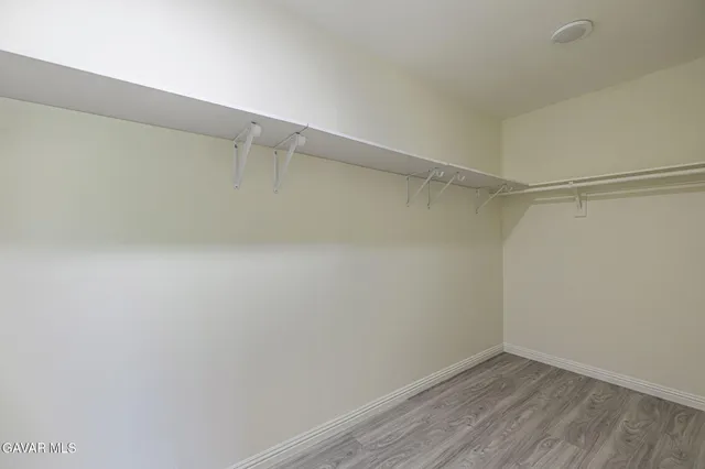 a view of an empty walk in closet
