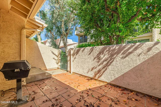 a view of a back yard of the house
