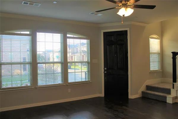 a view of livingroom with furniture window and wooden floor