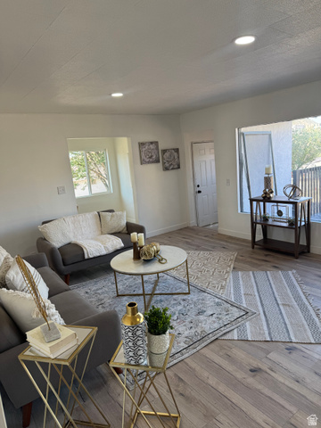47 B Street Helper, UT 84526 - Photo 13 of 19 Spacious living area featuring light wood-finish flooring, recessed lighting, and white wall finishes