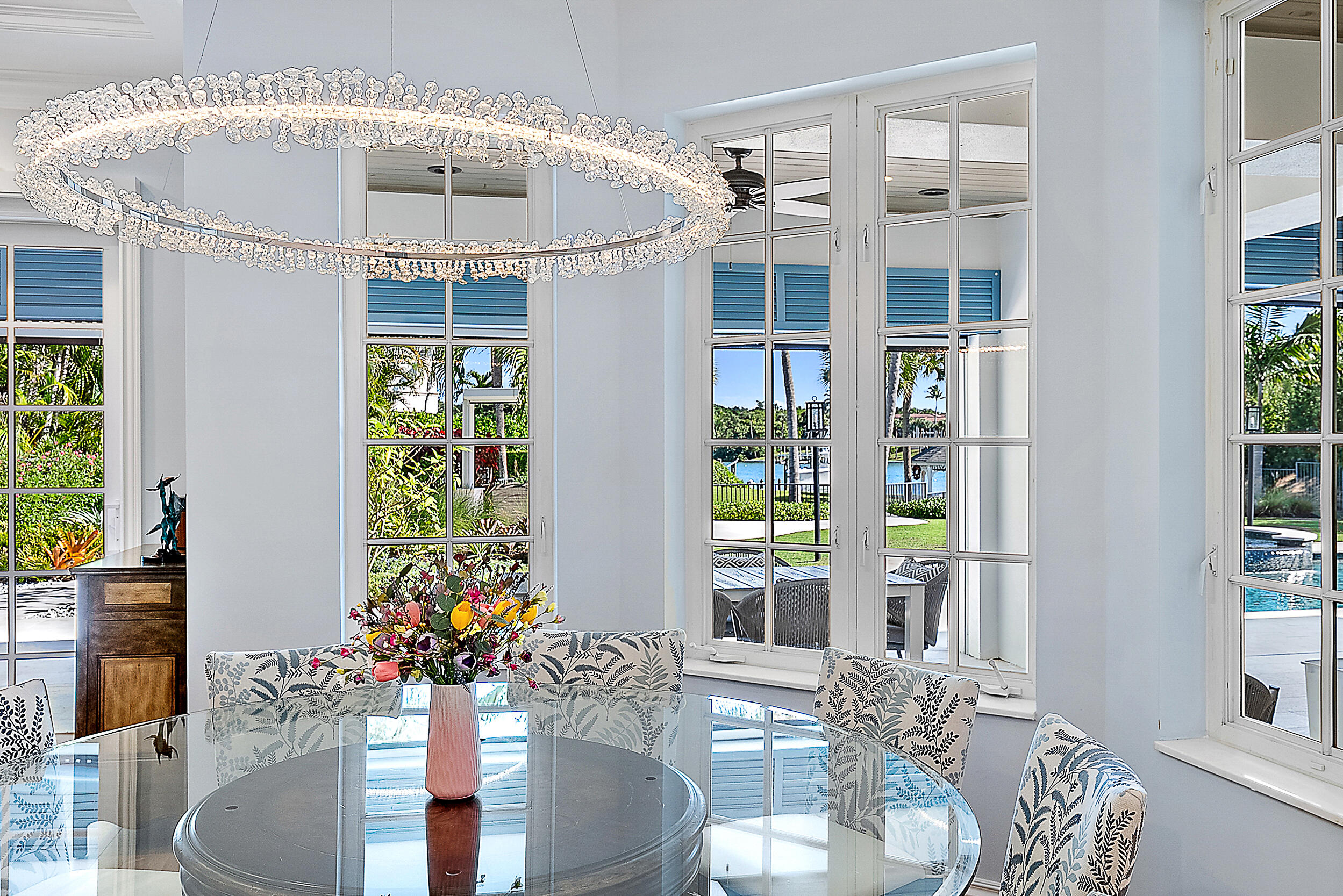 11971 Southeast Tiffany Way Jupiter, FL 33469 - Photo 13 of 53 a dining room with furniture and chandelier