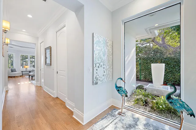 a spacious bathroom with a double vanity sink a mirror and a shower