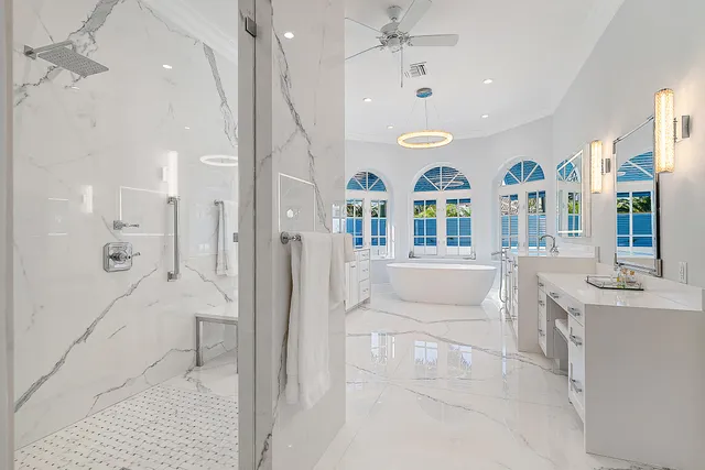 a spacious bedroom with a bed and a couch